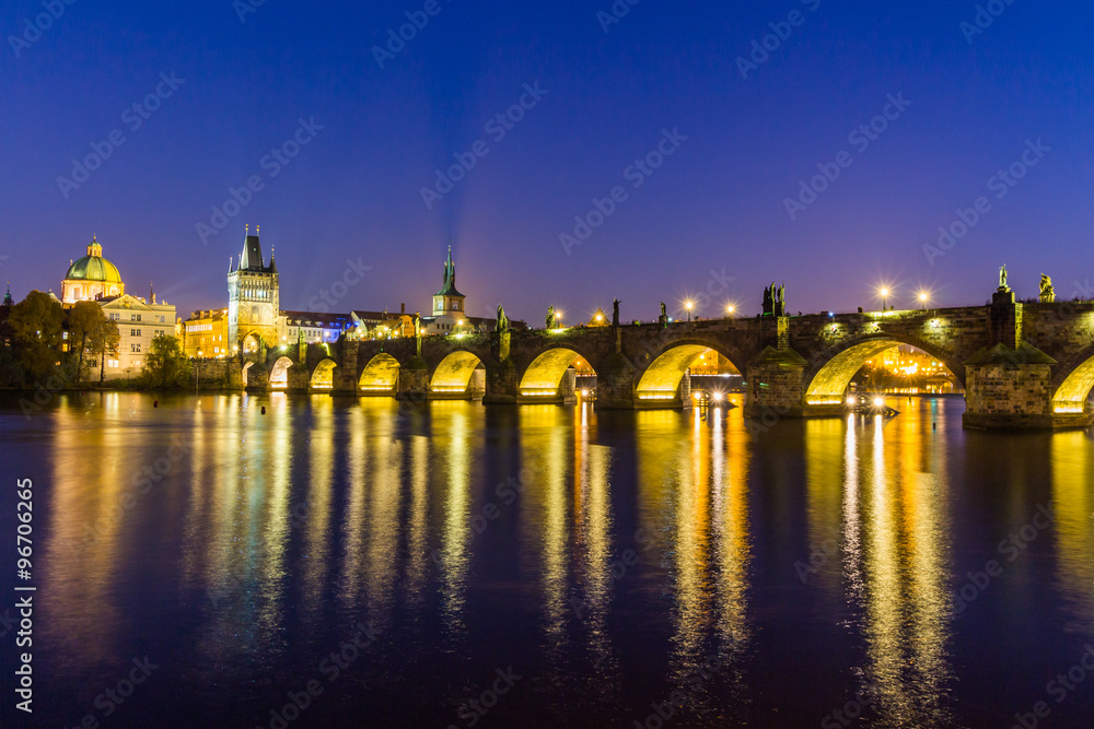 View at The Charles Bridge and Vltava river in Prague in dusk at sunset, Czech Republic