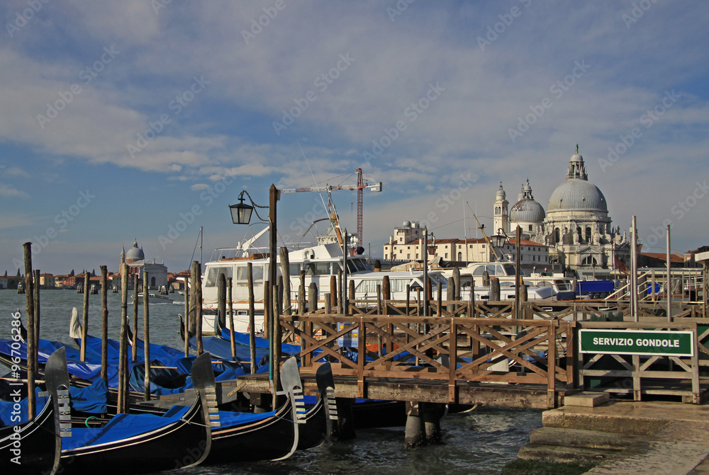 VENICE, ITALY - SEPTEMBER 02, 2012: The Basilica Santa Maria della Salute and parked gondolas in Venice, Italy