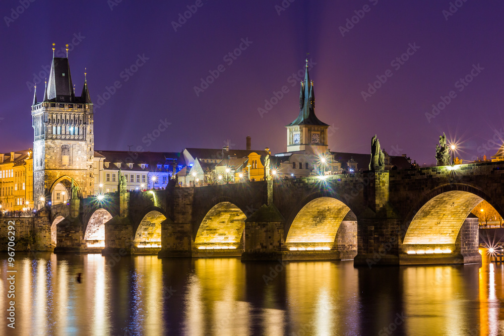 View at The Charles Bridge and Vltava river in Prague in dusk at sunset, Czech Republic