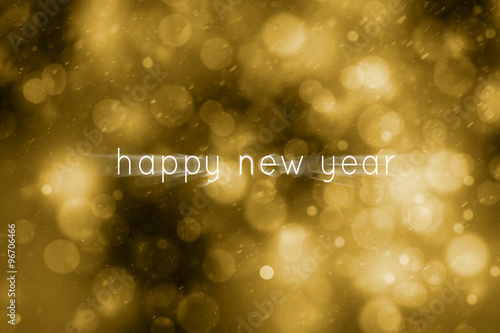 Magical abstract golden creative motion blurred happy new year written on blurred dark bokeh background. Beautiful gold colored happy new year greeting card copy space illustration background.