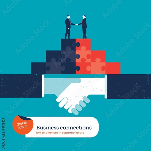 Businessmen shaking hands on a puzzle pyramid on a handshake.