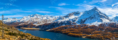 Panorama view of Sils lake and the Engadin Alps in golden autumn photo