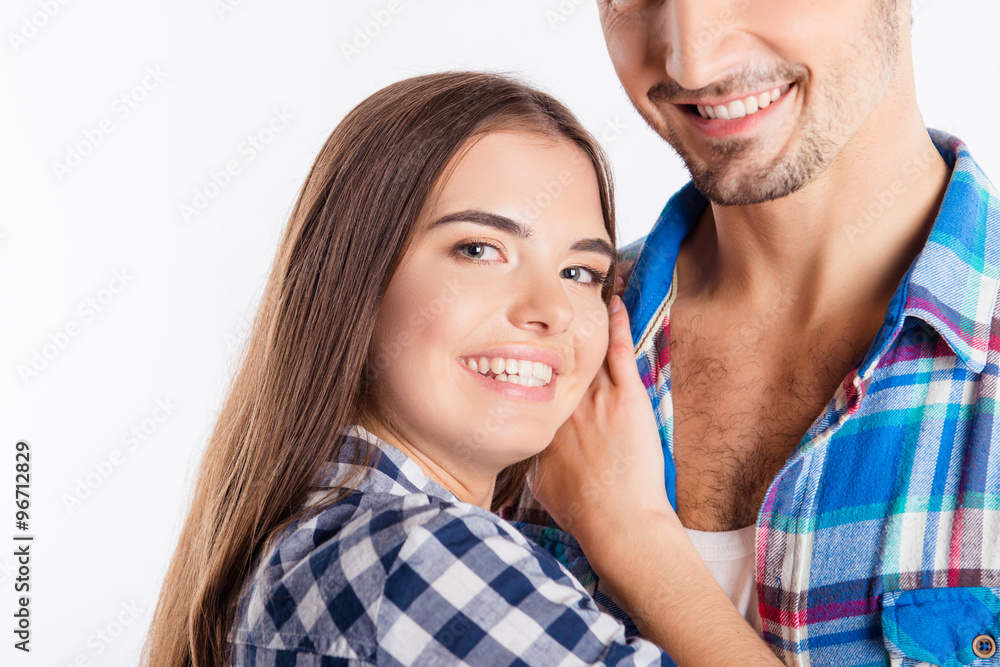 Closeup photo of a cheerful cute girl in love embracing her boyf Closeup photo of a cheerful cute girl in love embracing her boyf