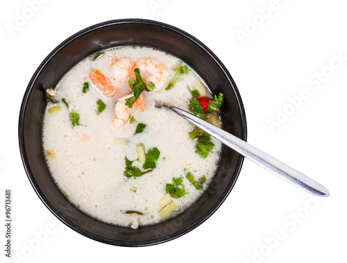 top view of sour and spicy soup Tom yam in bowl
