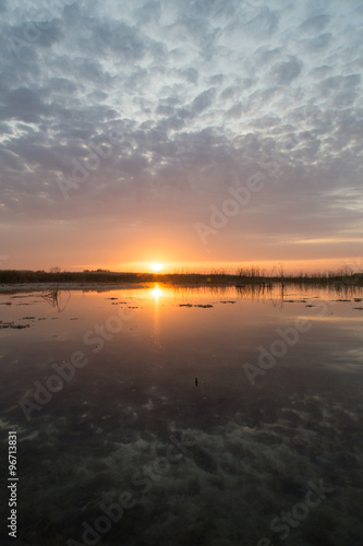 beautiful sunrise of the sun on the lake