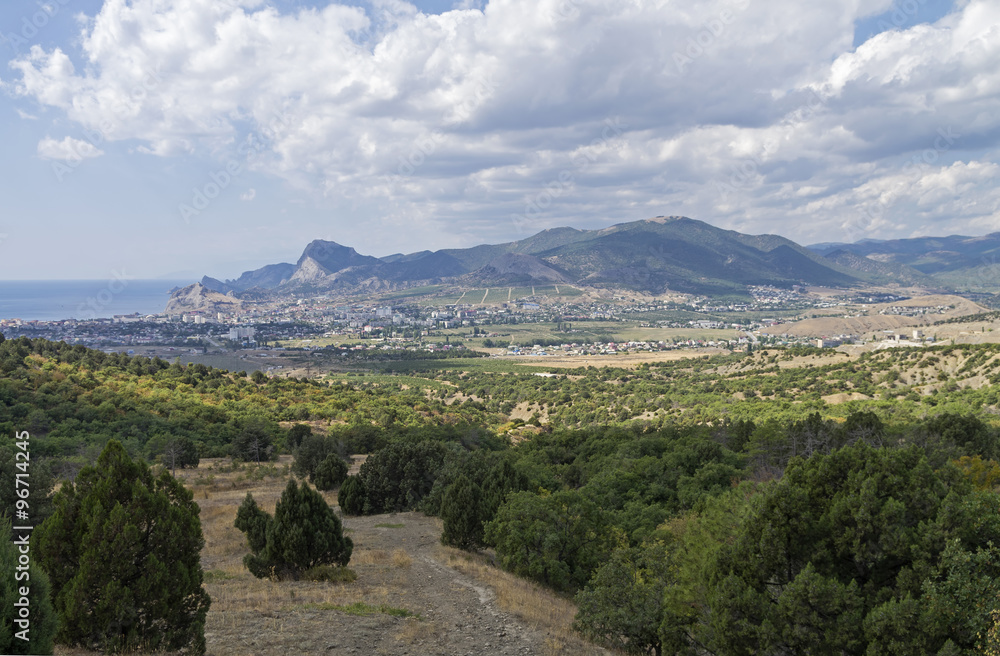 Panorama of a small resort town in Crimea from the mountainside