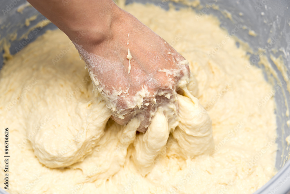 Making dough by female hands Making dough by female hands