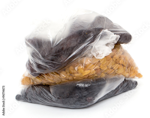Fototapeta Naklejka Na Ścianę i Meble -  black and yellow raisins in a plastic bag