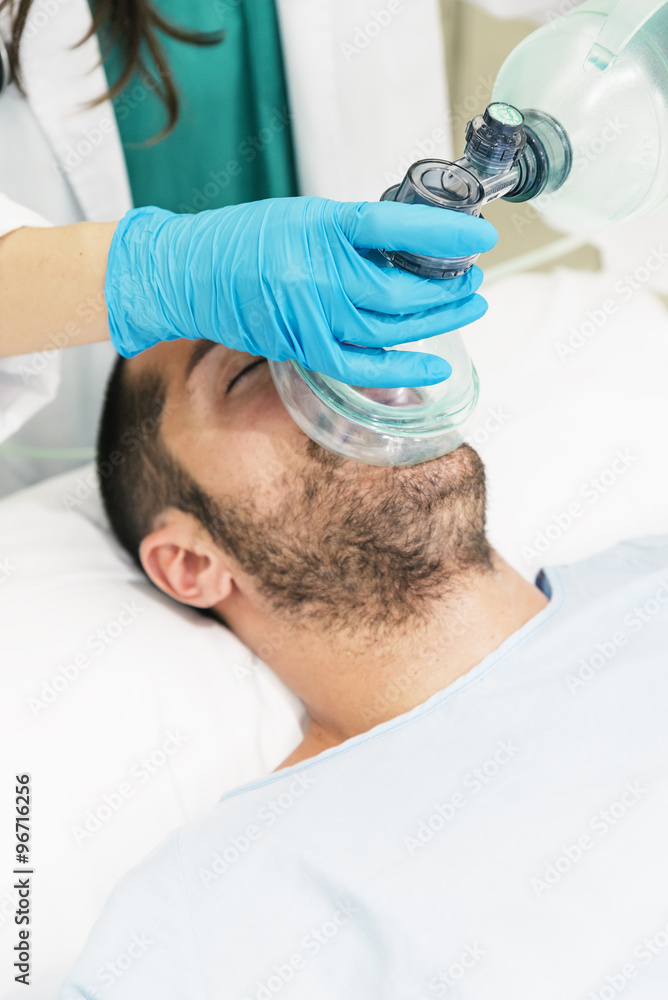 Doctor using the ball resuscitation with a patient Doctor using the ball resuscitation with a patient