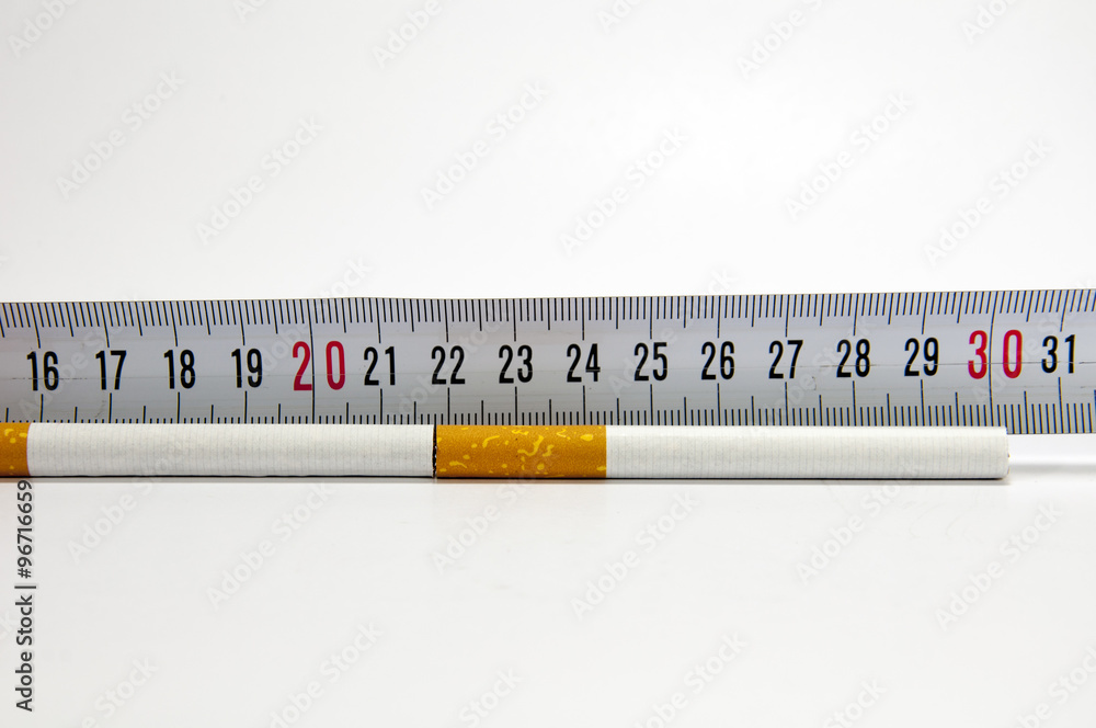 Smoking concept with measuring tape and cigarette Smoking concept with measuring tape and cigarette