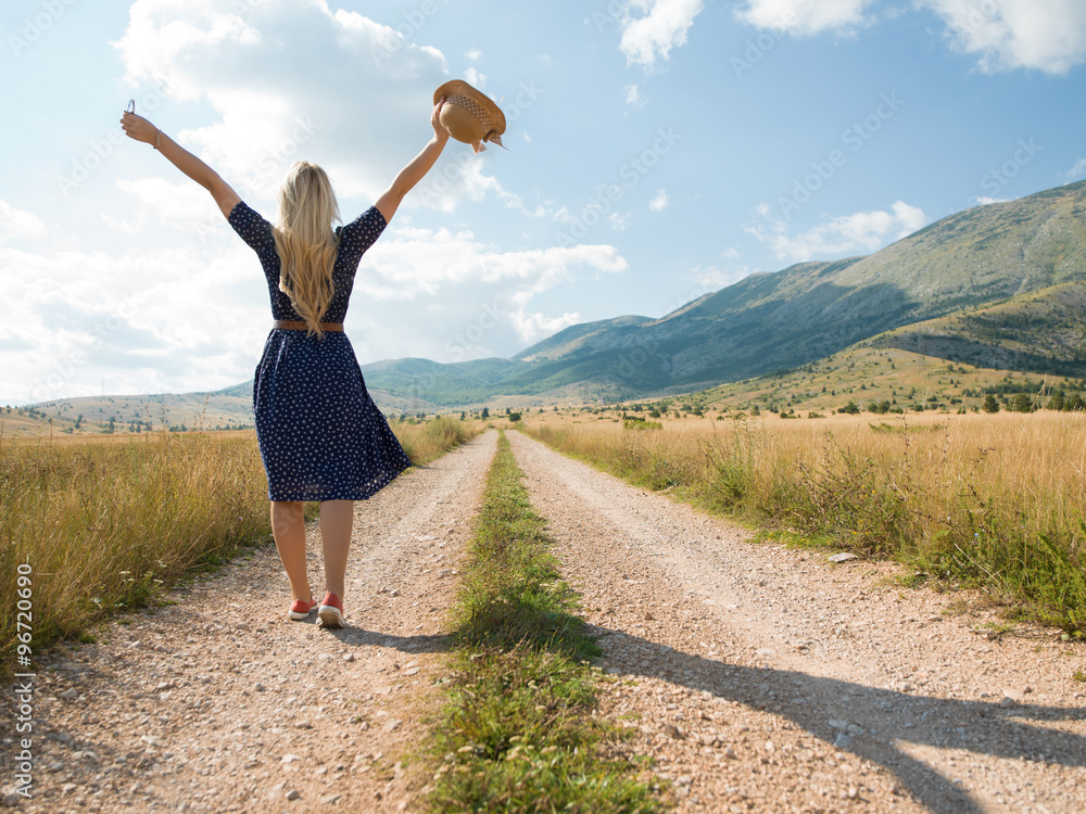 Fototapeta premium Portrait of beautiful girl in field