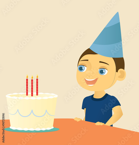 Boy blowing out candles on birthday cake