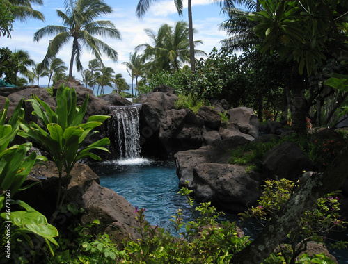 Tropical resort waterfall and lagoon