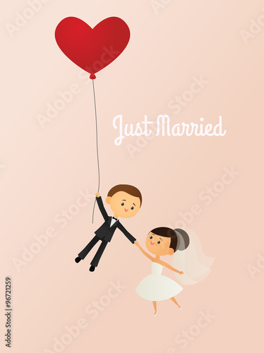 Just married bride and groom with a heart shaped balloon