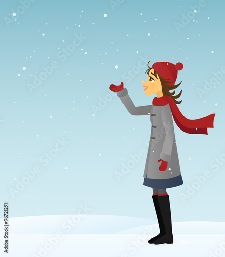 Young woman catching snow in her hand