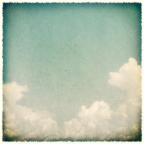 Clouds on a textured, vintage paper background
