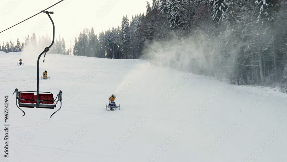 Snow machine gun on a ski slope. Stock Video Adobe Stock