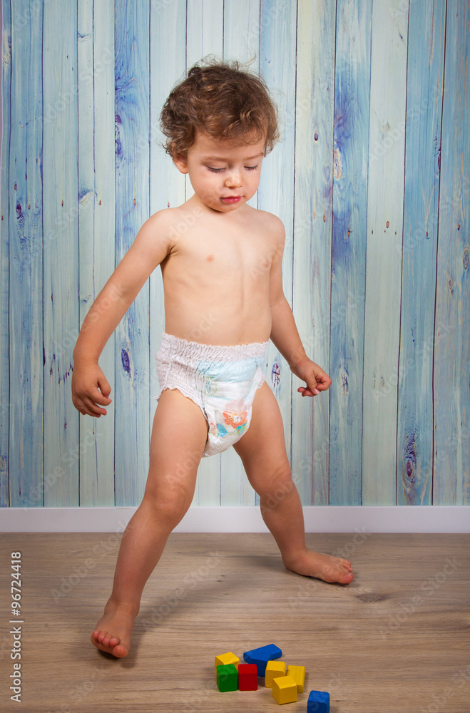 Baby boy in diaper фотография Stock