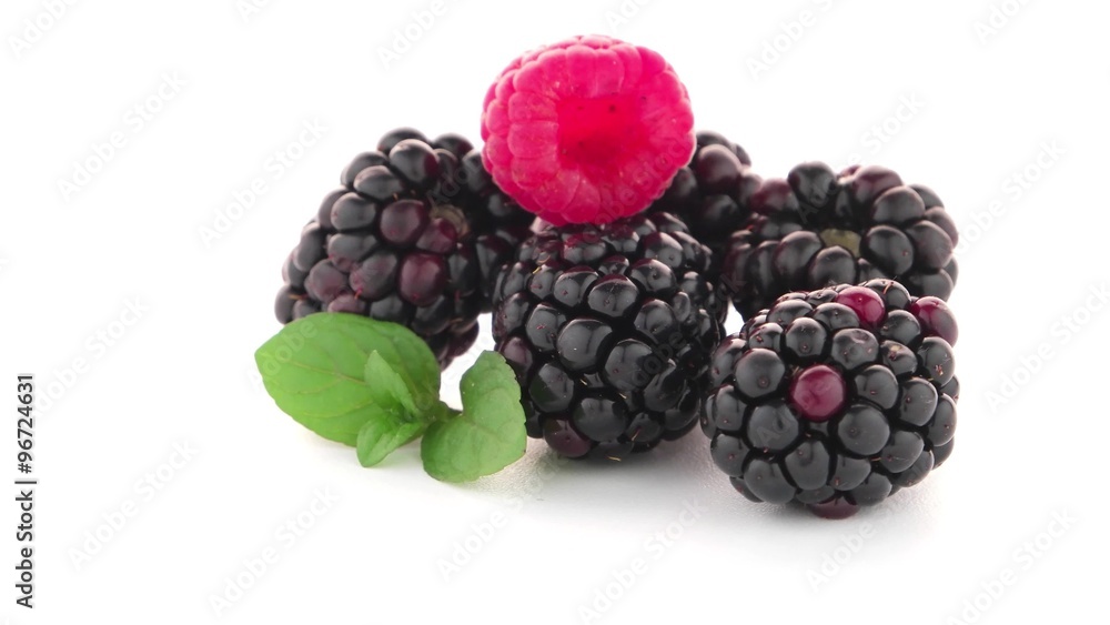 Raspberries and blackberry with mint leaf isolated on white background. Raspberries and blackberry with mint leaf isolated on white background.
