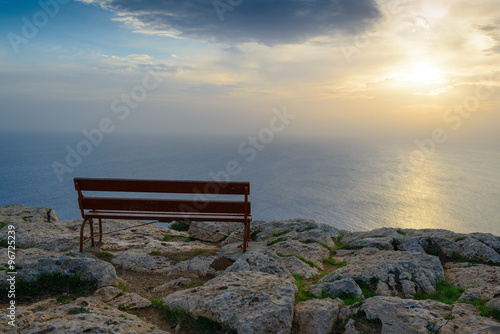 Lonely bench on the coast. Cape Cavo Greco. Cyprus