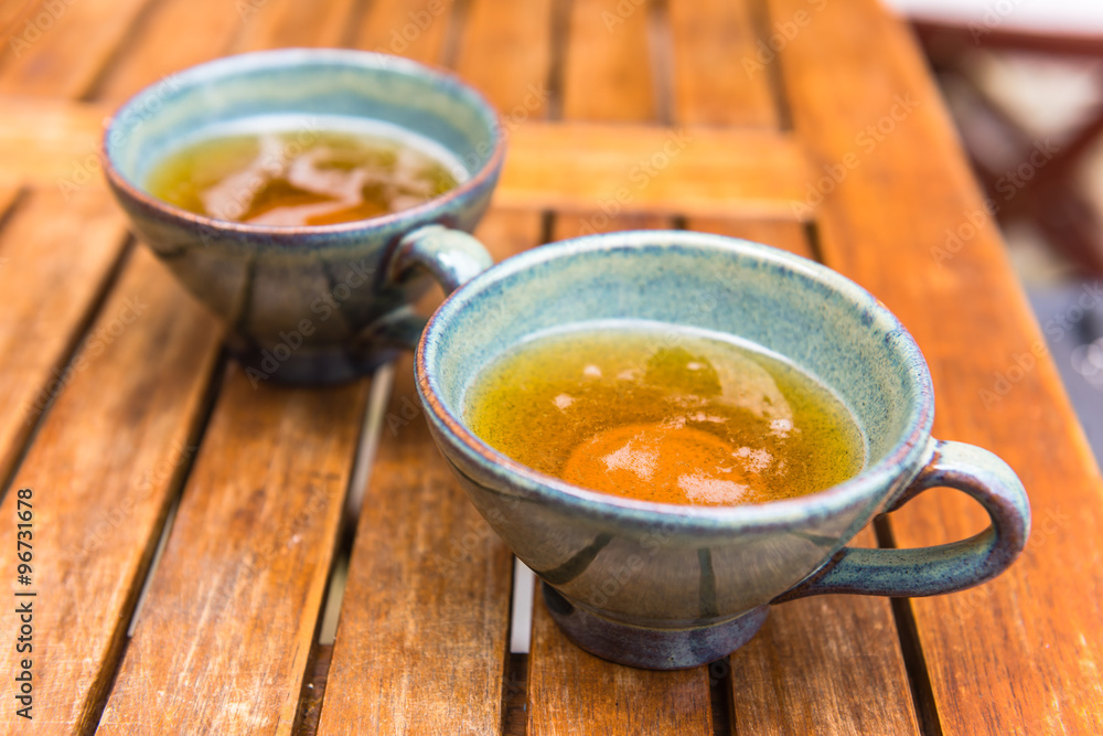 Norman apple cider in a typical ceramic cups Norman apple cider in a typical ceramic cups