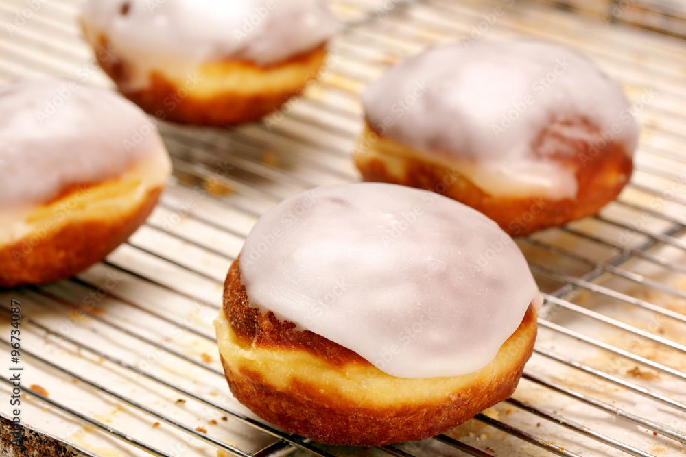 Fresh donut with icing in bakery Fresh donut with icing in bakery