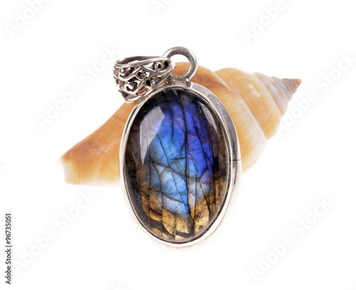  silver jewelry pendant with a stone (mineral) Labradorite   on snail shell. photo