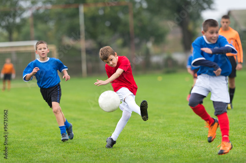 boy kicking football © Dusan Kostic