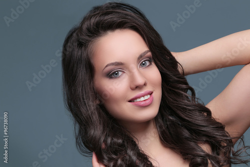 Attractive woman on a blue background