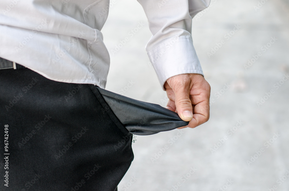Business man showing close up his empty pocket
