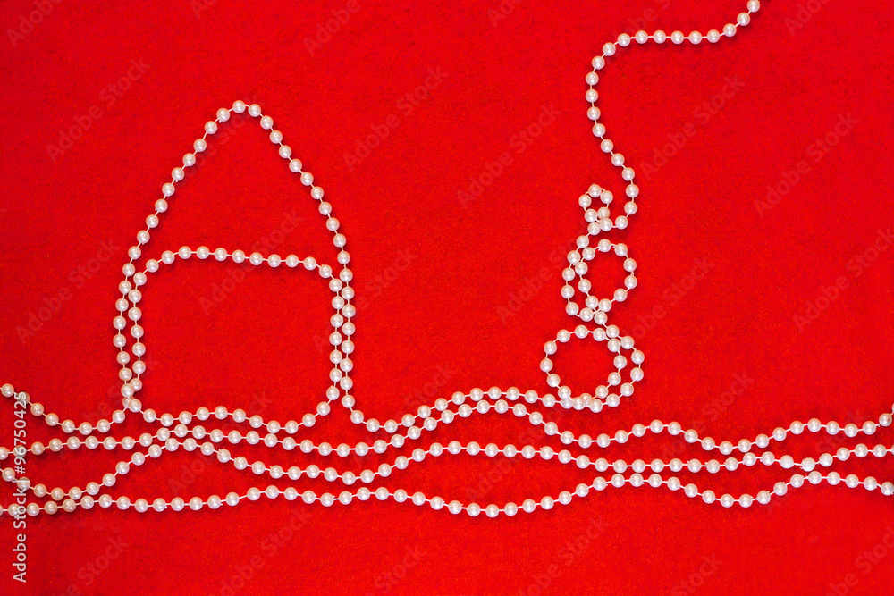 Winter scene with house and snowman made of white beaded necklac Winter scene with house and snowman made of white beaded necklac
