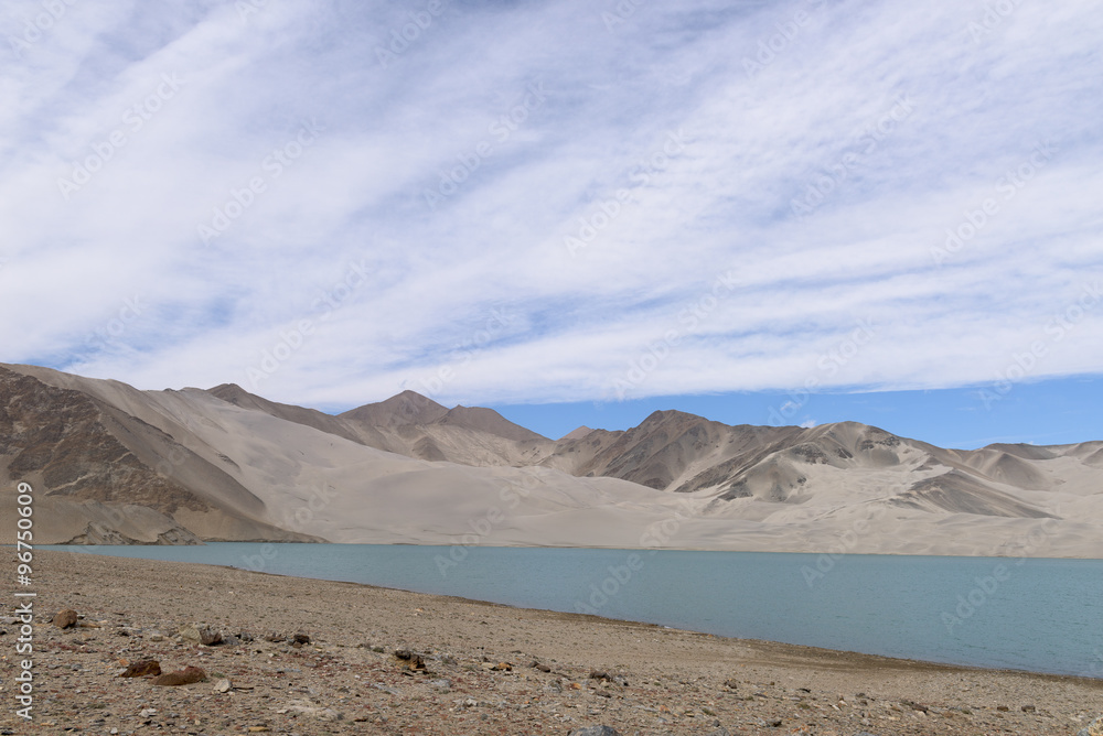 Landscape of Karakul lake, in Xinjiang province of China lies on the Karakoram Highway linking Kashgar in China with Islamabad in Pakistan. It's in the Pamir mountain range.
