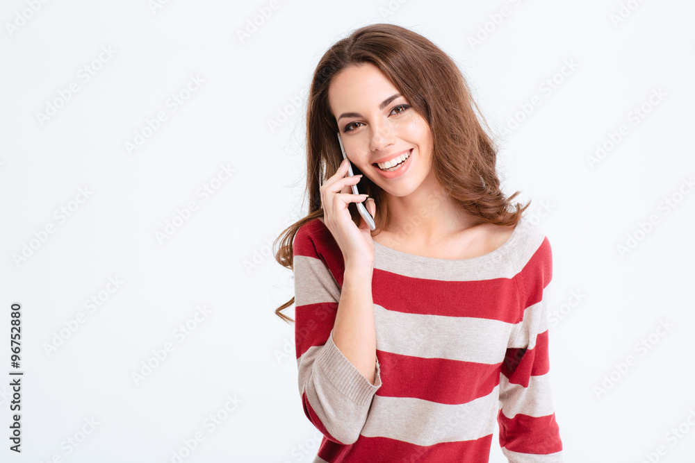 Woman talking on the phone and looking at camera Woman talking on the phone and looking at camera