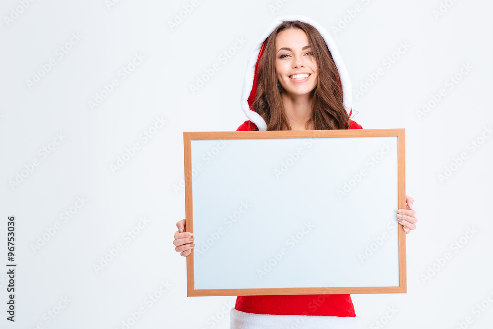 Smiling woman in santa claus cloth holding blank board Smiling woman in santa claus cloth holding blank board