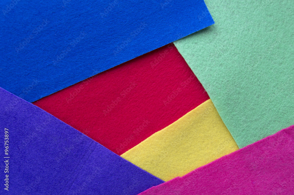 background with several layers of fabric of different colors. Yellow, red, blue, green, violet and pink. background with several layers of fabric of different colors. Yellow, red, blue, green, violet and pink.