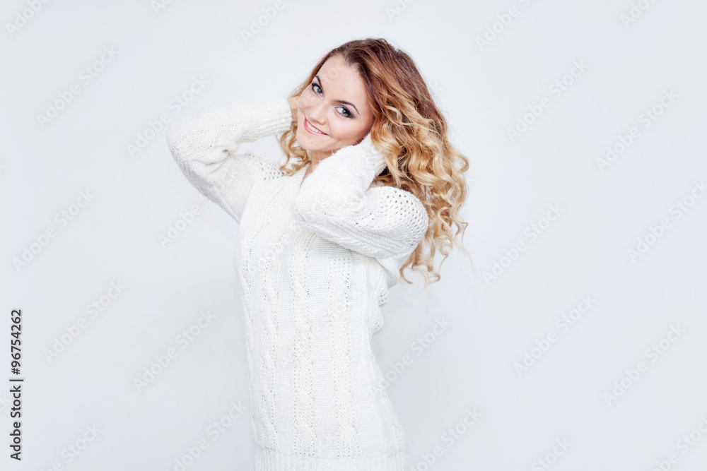 Woman in warm sweater, portrait on white background Woman in warm sweater, portrait on white background