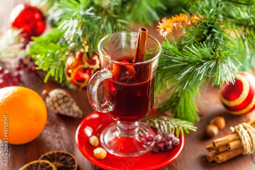 Mulled wine with citrus fruits and cinnamon. Traditional winter hot drink for Christmas.