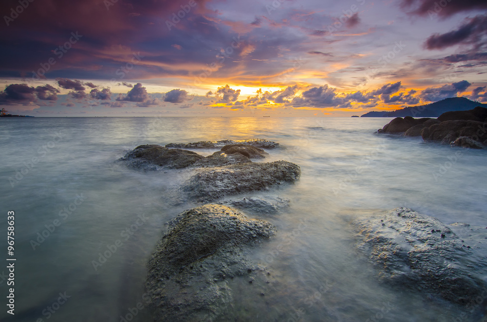 sunrise at rocky beach in terengganu, malaysia. image taken with sunrise at rocky beach in terengganu, malaysia. image taken with