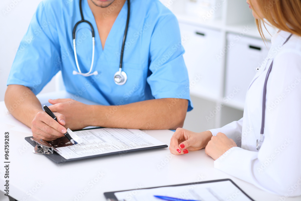 Two doctors are discussing medical history Two doctors are discussing medical history