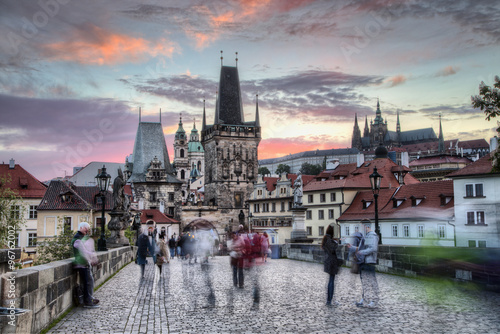 Dramatic scene with cloudy sunrise sky as seen from the Charles bridge in Prague