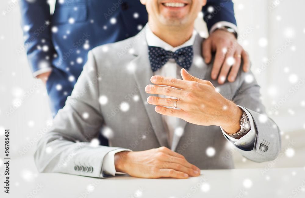 close up of male gay couple with wedding rings on close up of male gay couple with wedding rings on