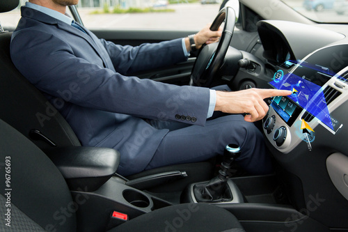 close up of man driving car with navigation