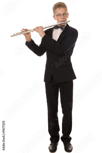Boy in a suit playing a flute
