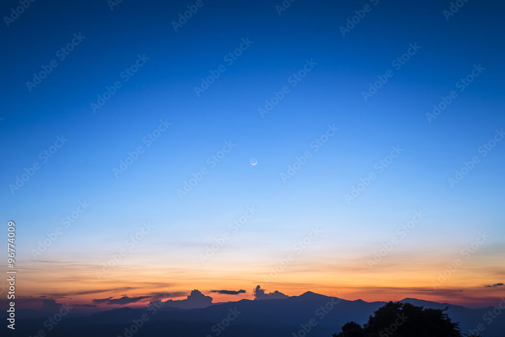twilight sky with the crescent moon in winter at the north of Thailand - obrazy, fototapety, plakaty 