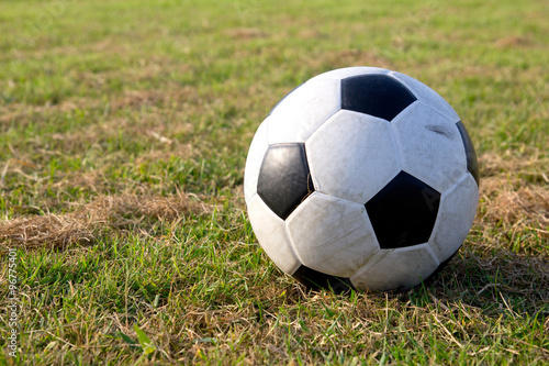 a ball on green football or soccer field