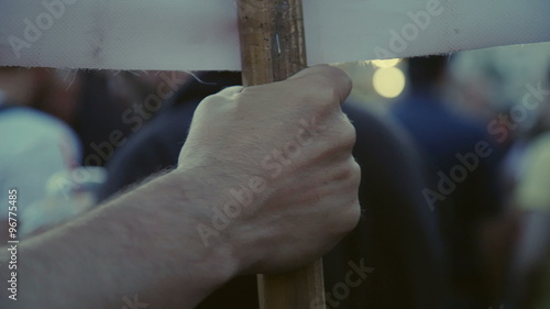 Hand holding a placard/sign firmly at a protest,referendum,grexit 2015 photo