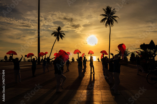 Local people exercise in sunrise at Nha Trang beach, Khanh Hoa, Vietnam. Nha Trang is well known for its beaches and scuba diving and has developed into a destination for international tourists.