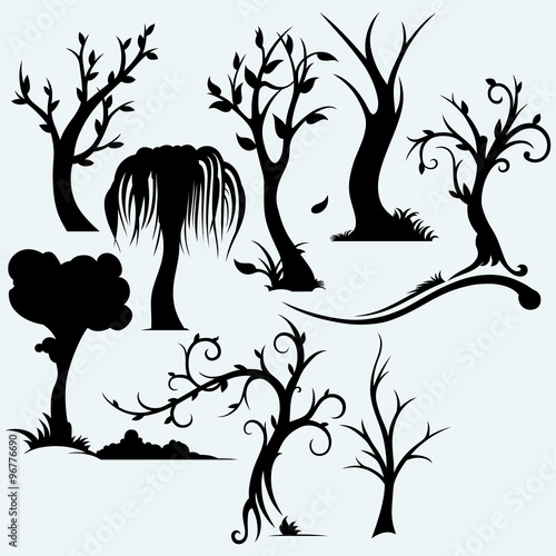 Collection of bare trees. Isolated on blue background. Vector silhouettes
