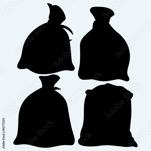 Set sacks of grain. Isolated on blue background. Vector silhouettes