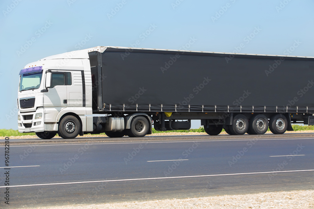 truck transports freight on highway truck transports freight on highway